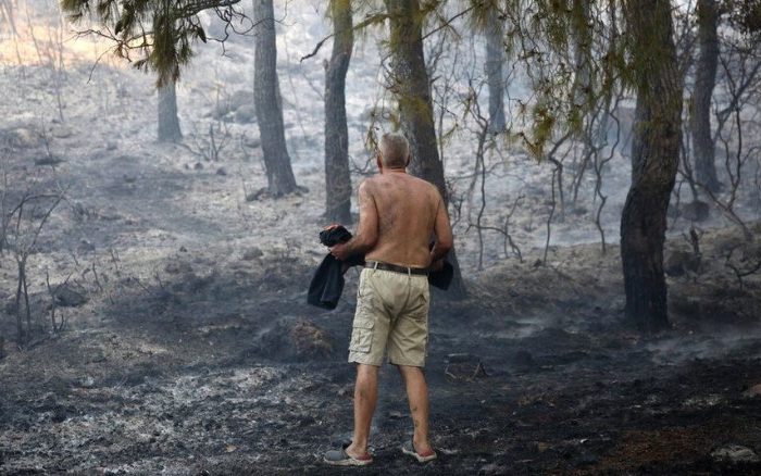 Firefighters in action as wildfire spreads around Athens